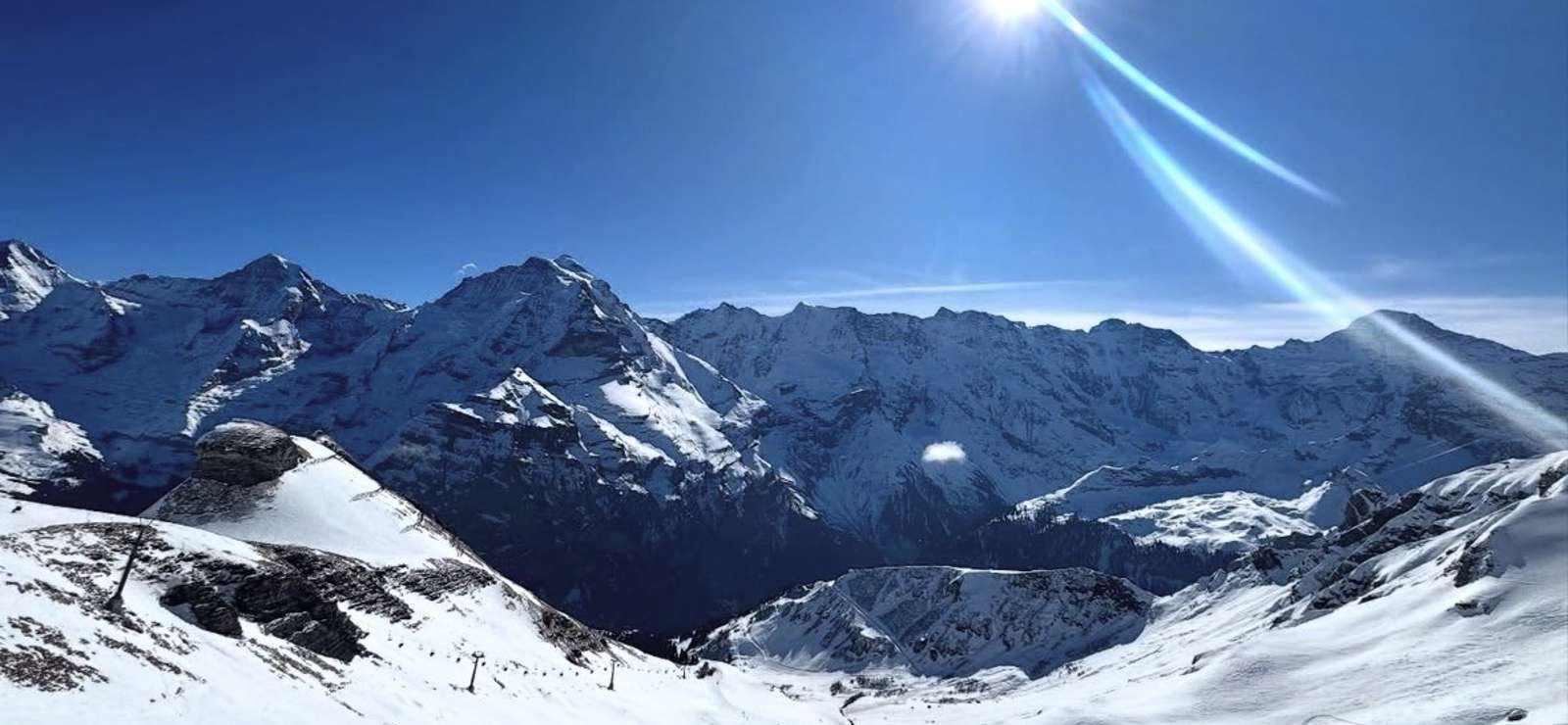 Snow-covered slopes and mountain panorama on the Schilthorn ski route above Lauterbrunnen