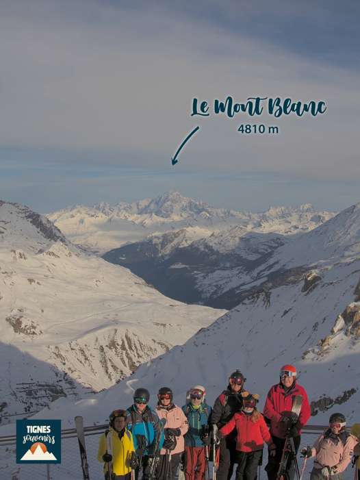 Ski group at the Tovière viewpoint with Mont Blanc in the distance on the return to Tignes.