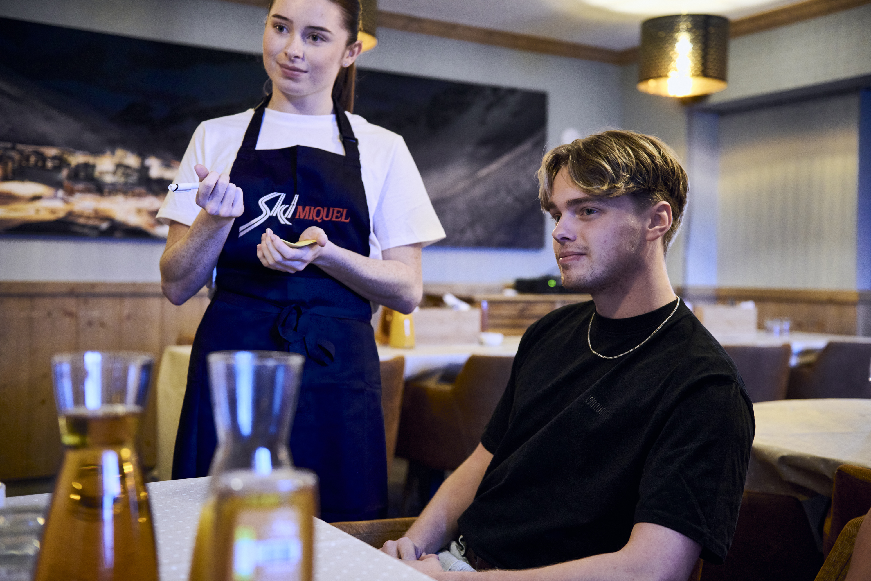 ski Miquel staff member taking an order