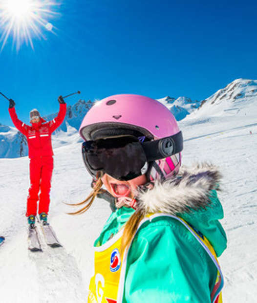 in Tignes ESF teacher and happy child