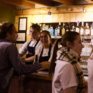 People standing at the Rosset bar