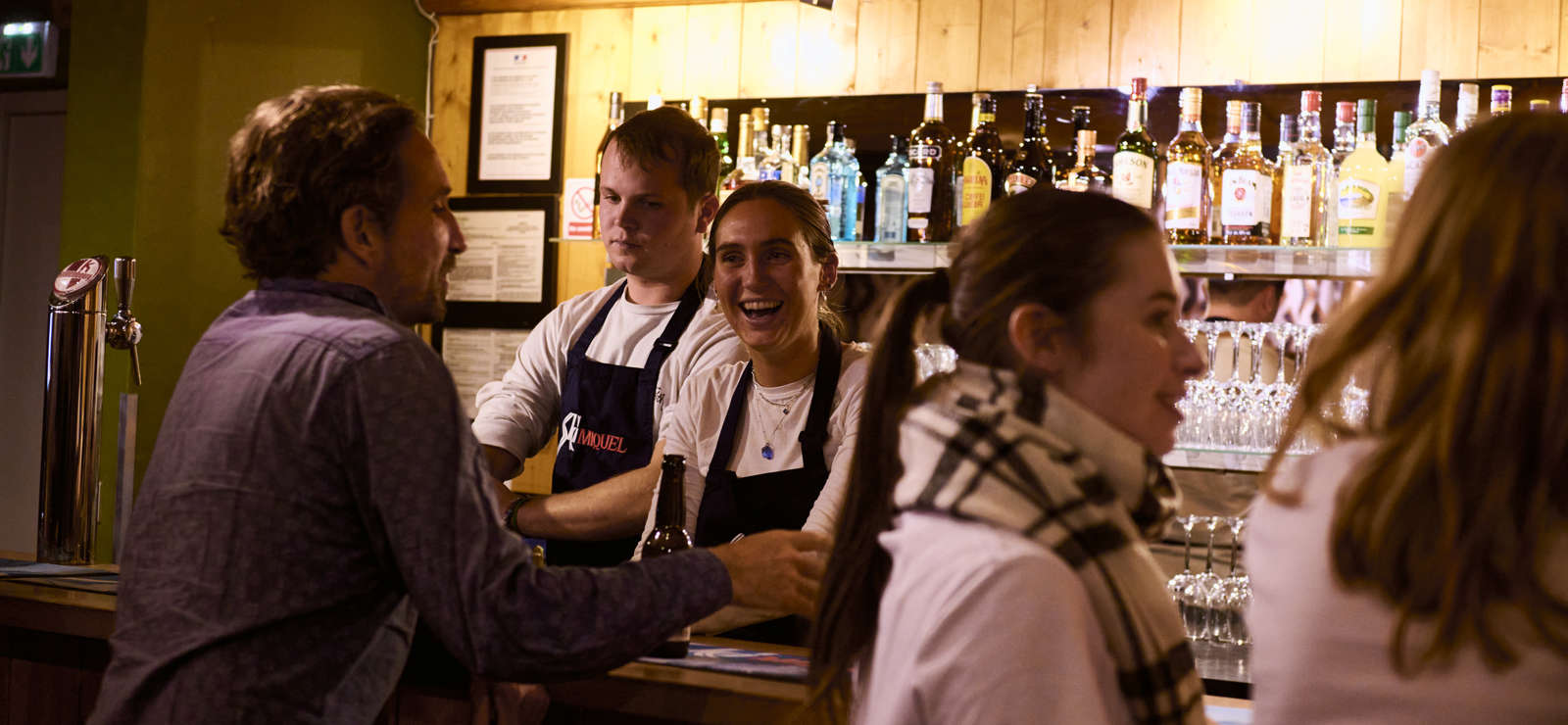 People standing at the Rosset bar